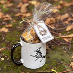 Load image into Gallery viewer, Our magical mascot Winnie the Wiz has her very own mug! Stir up your own personal potion with our &#39;Witch&#39;s Brew&#39; mug gift set, perfect for warming up with this season! This gift set contains our &#39;Winnie ceramic mug&#39; (11oz/330ml) and a bag of our &#39;Gingerbread Latte Fudge&#39; (150g) or a pouch of &#39;Witch&#39;s Toads&#39; (160g) - either make the perfect treat this Halloween! (Select your option with the drop down!)
