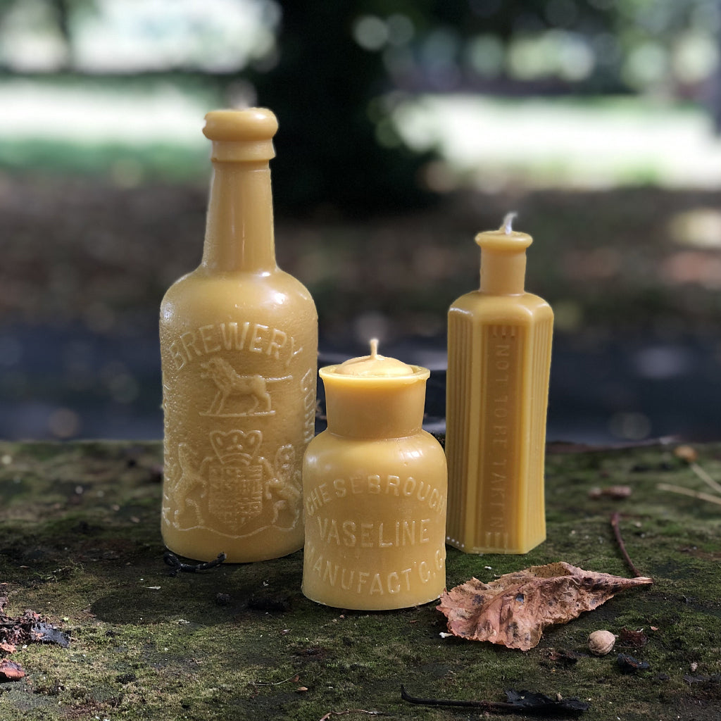 This striking beeswax candle is created from an original Alnwick Brewery antique bottle. With approximately 70 hours of burn time, watch as the candle's flame slowly begins to light up the intricate lion crest. Hand poured in the UK using 100% British beeswax.