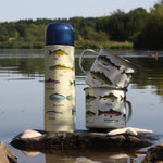 Load image into Gallery viewer, We are in love with our ecology enamelware mugs - This one is perfect for the fisherman in your life, or for your own adventure! Whether it&#39;s a weekend away, to brighten up the kitchen or as a gift, these mugs are a perfect eco-friendly alternative to disposable cups. Embrace nature with this enamel mug with all over fish print. Enjoy at home or out and about with these versatile mugs, available in a range of styles!
