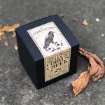 Load image into Gallery viewer, The nights are drawing in and the leaves are beginning to fall! - time to cosy up and enjoy spooky season with this gorgeous skull candle from The Upturned Cauldron.  Learn their curious origin story beautifully presented in this gift box - the perfect addition to your abode this season, if you can bear to light it!
