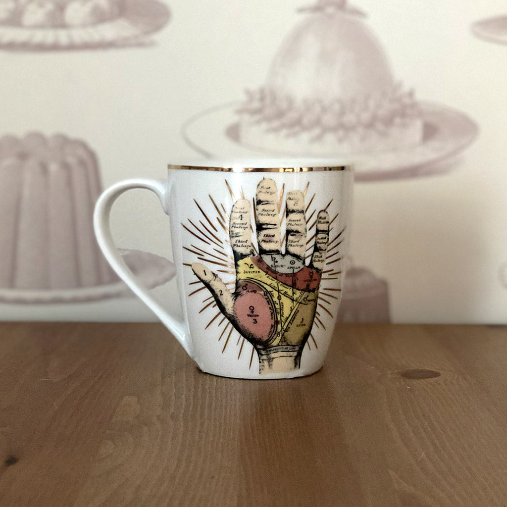 Beautifully designed, this Temerity Jones mug has a palmistry handprint with metallic gold detailing. The hand print design features on the front and back of the mug and is presented in a coloured design box. We can already tell that this would be a great gift for any budding palmistry fans!